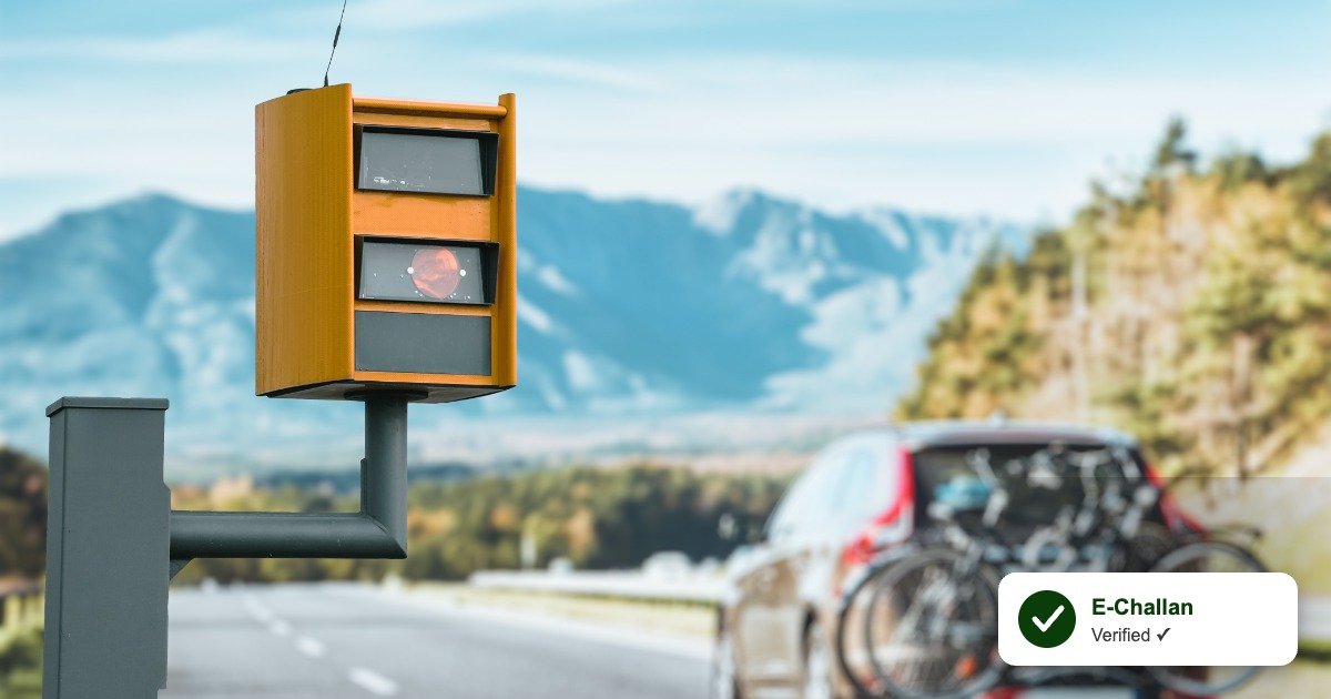 A speed camera on a highway with a car passing in the background, with an E-Challan verified checkmark badge overlay